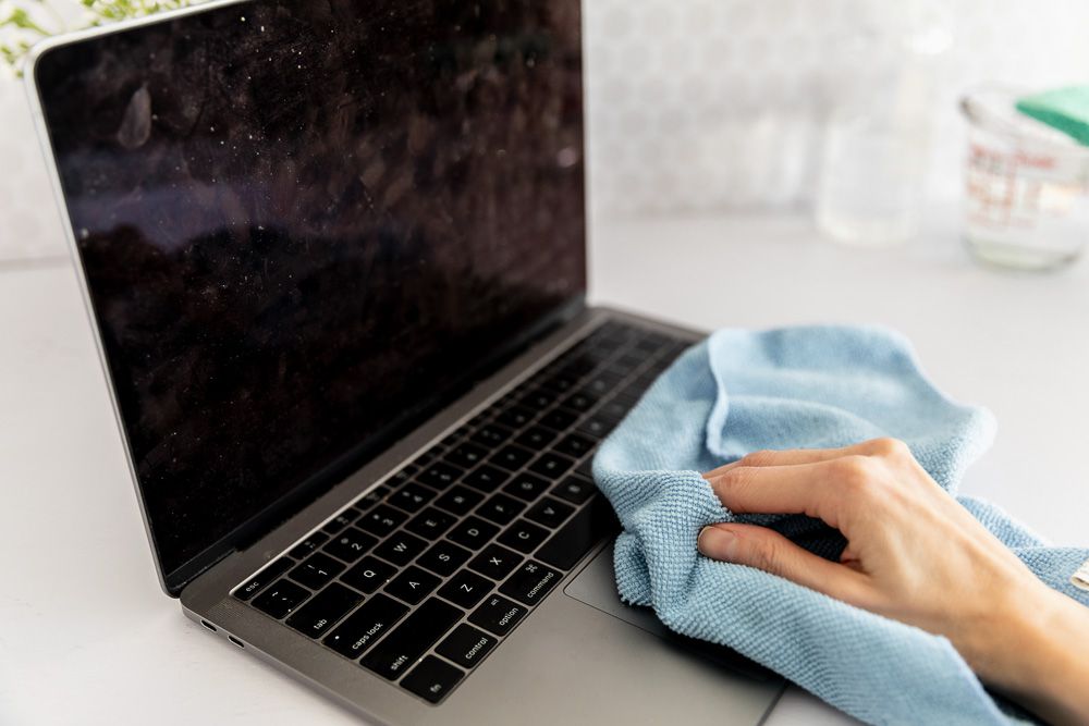 Check for any accumulated dirt or debris on the laptop screen.
Gently wipe the affected area with a soft, lint-free cloth.