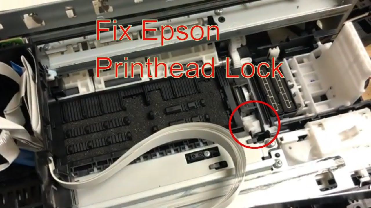 Open the printer cover and wait for the printhead to move to the center.
Press the tab on the side of the cartridge and lift it out of the printer.