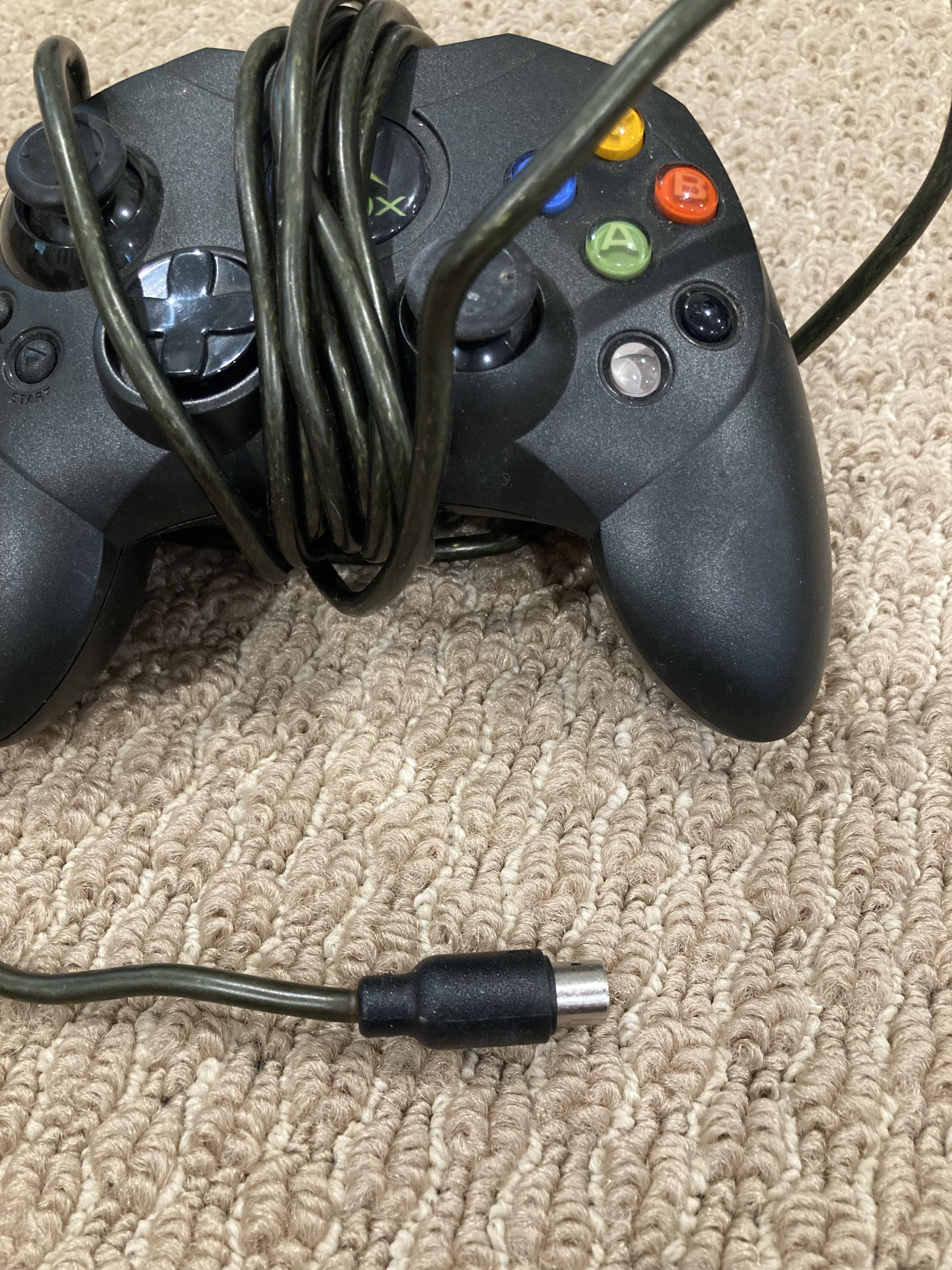 Plug one end of the USB cable into the USB port on the front of the console.
Plug the other end of the USB cable into the USB port on the Xbox One controller.