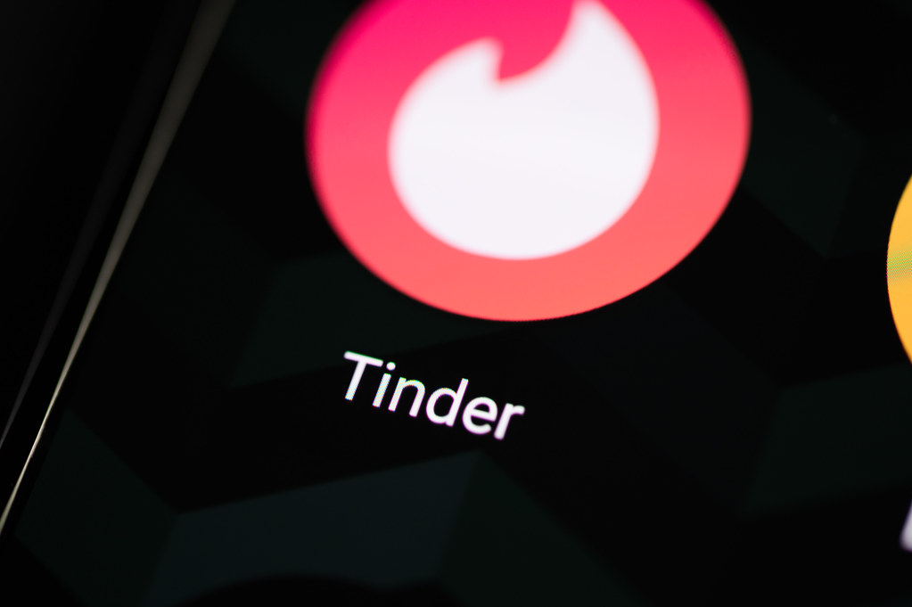 Smartphone with Tinder app icon on screen