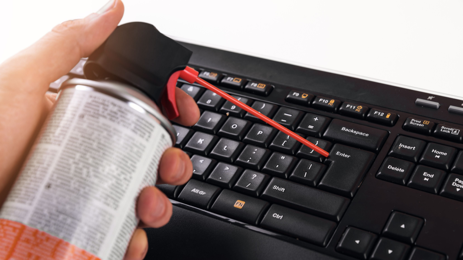 Turn off your computer or laptop before starting to clean the keyboard to avoid accidental inputs and potential damage to the device.
Remove any debris or dust from the keyboard with a can of compressed air or a soft-bristled brush.